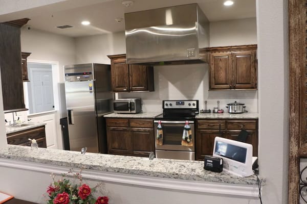 Clean kitchen area with modern appliances