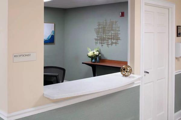 Reception area with a desk and decorative elements