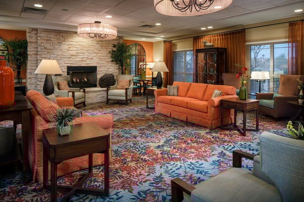 Bright common area with colorful seating and decor