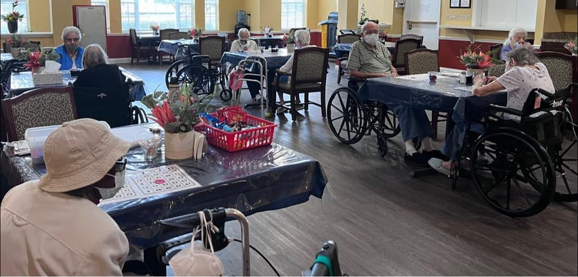 Residents participating in a bingo game in a common area