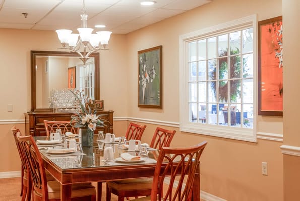 Elegant dining room setup with dining table and chairs