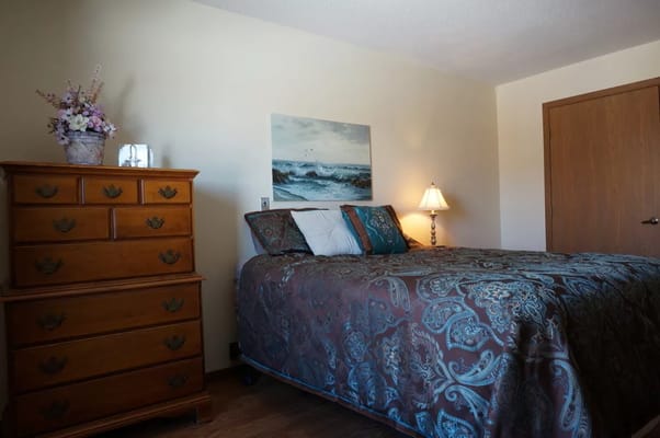 Cozy bedroom with wooden furniture and decor