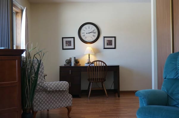 Cozy interior space with clock and desk