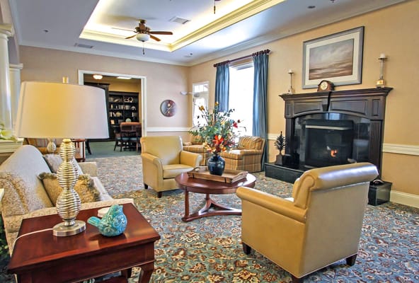 Interior common area with cozy seating and a fireplace