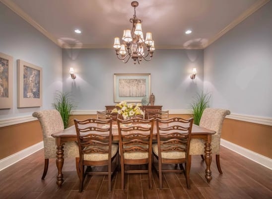 Dining room with large wooden table and elegant decor