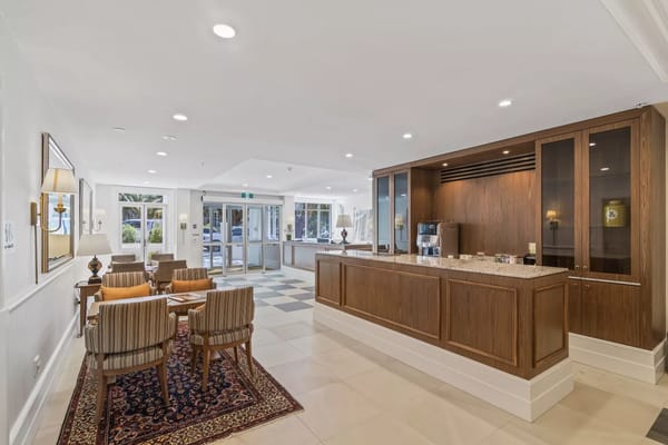 Bright common area with seating and a reception desk