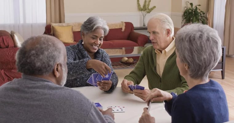 Residents engaged in a card game activity