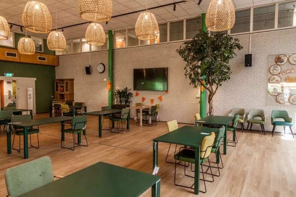 Interior view of a common area with tables and seating