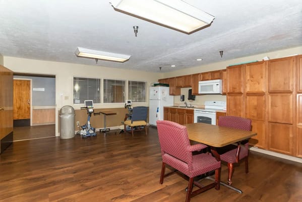 Spacious common area with kitchen and seating at Bethany Village.