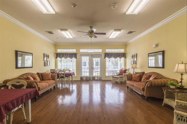 Bright common area with seating and tables