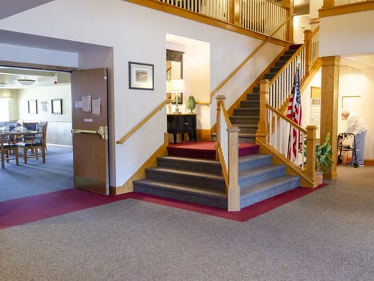 Bright interior lobby with staircase and seating area