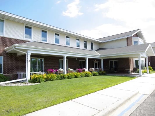 Exterior view of Bethesda Towne Square with flowers and greenery