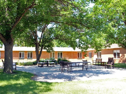 Outdoor patio with seating area at the facility