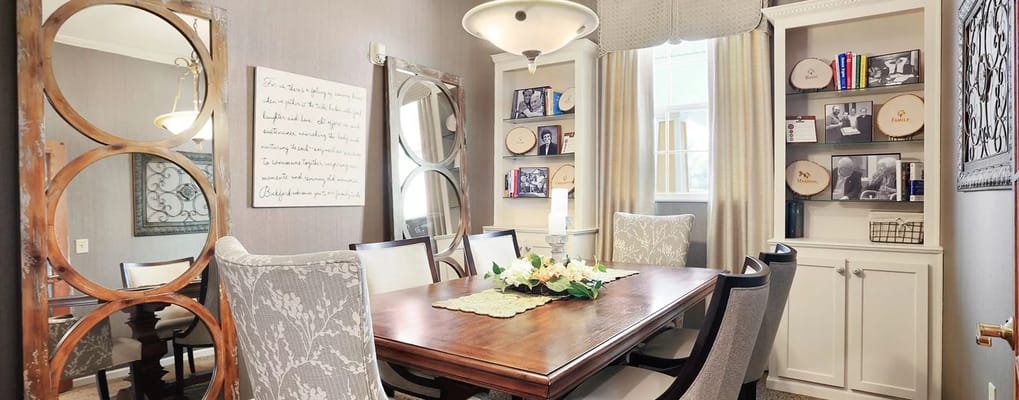 Bright and inviting common area with a dining table