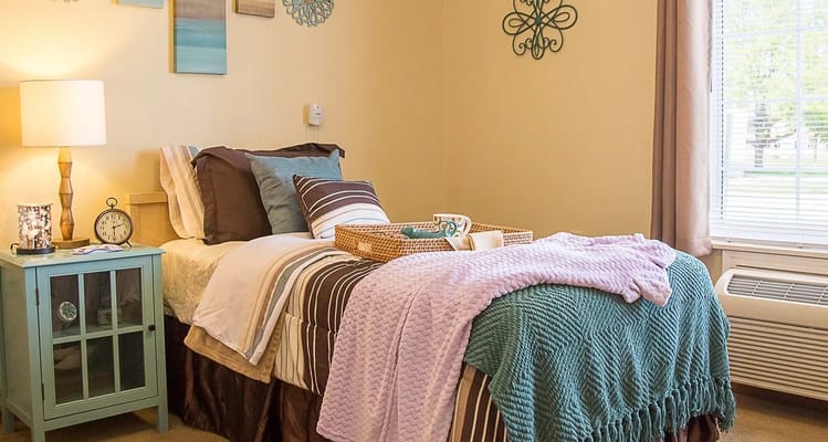 Cozy resident room with bed and decorative items