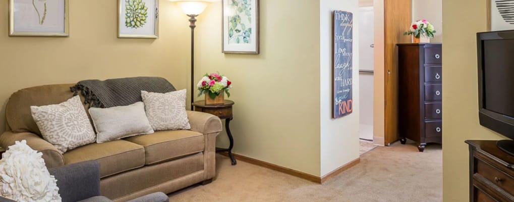 Cozy resident room with comfortable seating and decor