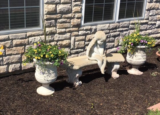 Outdoor bench with decorative flowers