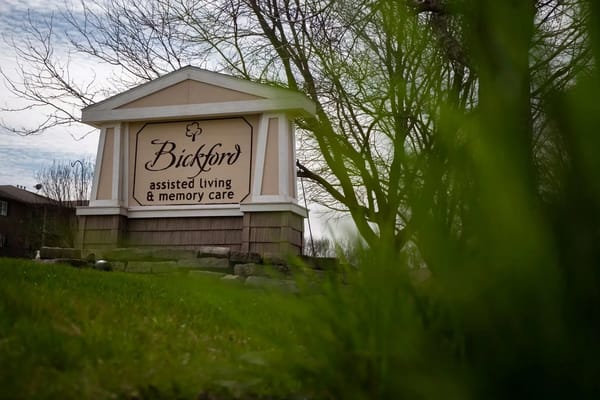 Sign for Bickford Assisted Living & Memory Care in a green garden