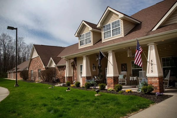Exterior view of the assisted living facility with well-maintained landscaping