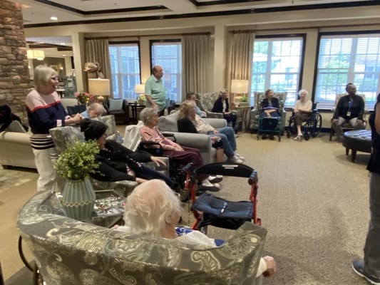 Residents participating in a group activity in the lounge