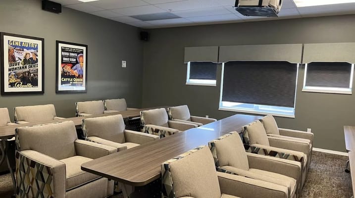 A well-lit common area with comfortable seating
