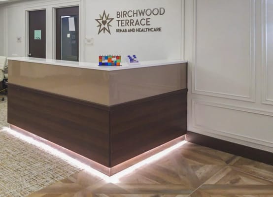 Reception desk at Birchwood Terrace with a welcoming design.