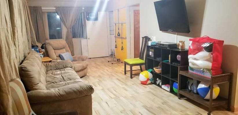 Common area with seating and games visible