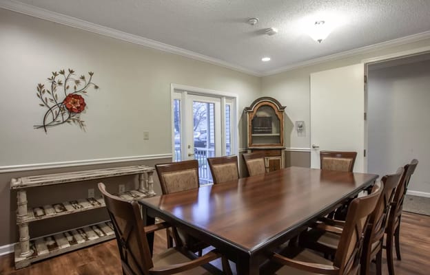 Dining room with a large wooden table and chairs