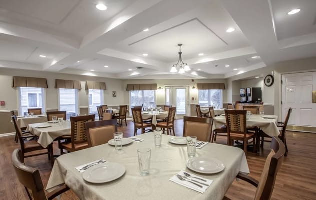 Interior view of a dining room set up for meals