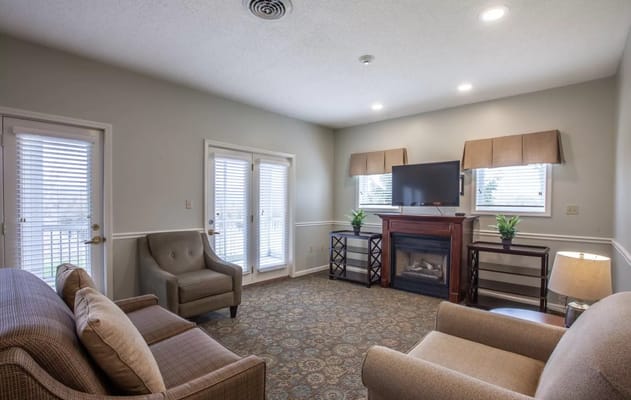 Common area living room with seating and TV