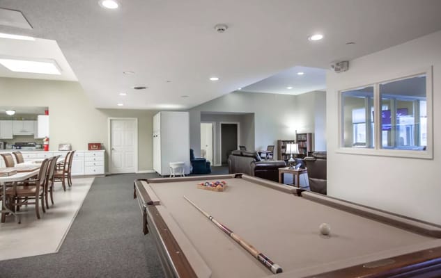 Interior view of a common area with a pool table