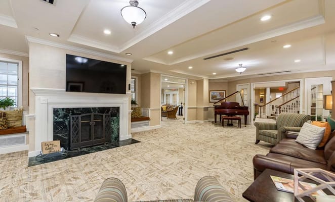 Bright and inviting common area with piano and seating
