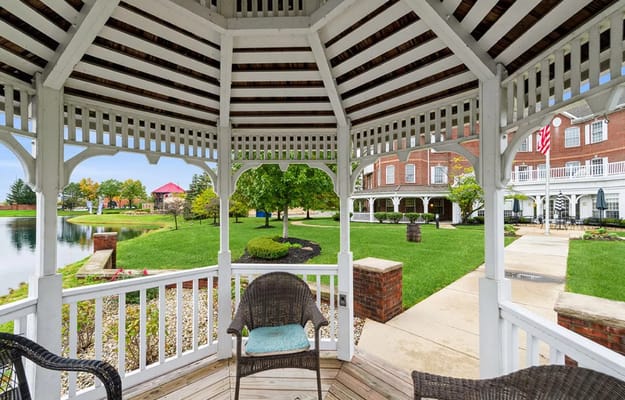 An outdoor gazebo with a view of the facility grounds