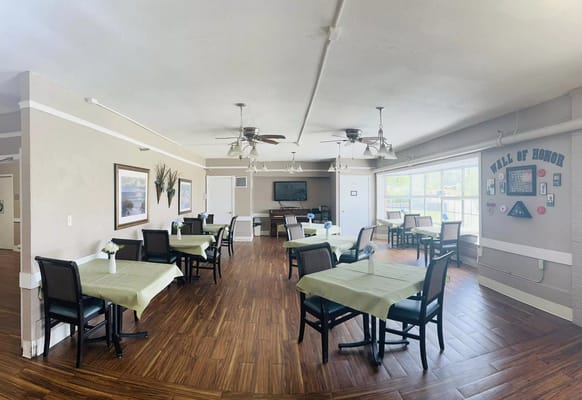 Bright dining room with tables set for meals