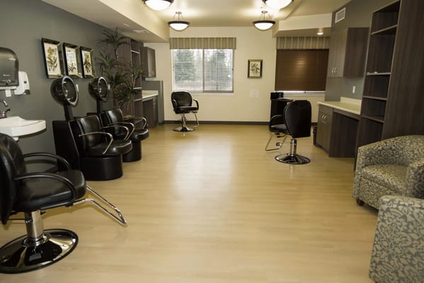 A beauty salon area with styling chairs