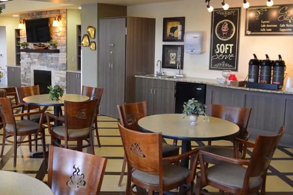 Cozy dining area with tables and chairs