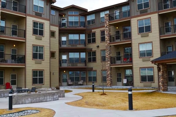 Exterior view of a senior living facility with courtyard