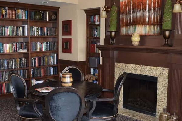 Cozy reading area with bookshelves and seating