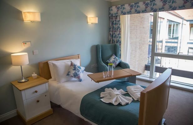 A well-appointed bedroom with natural light