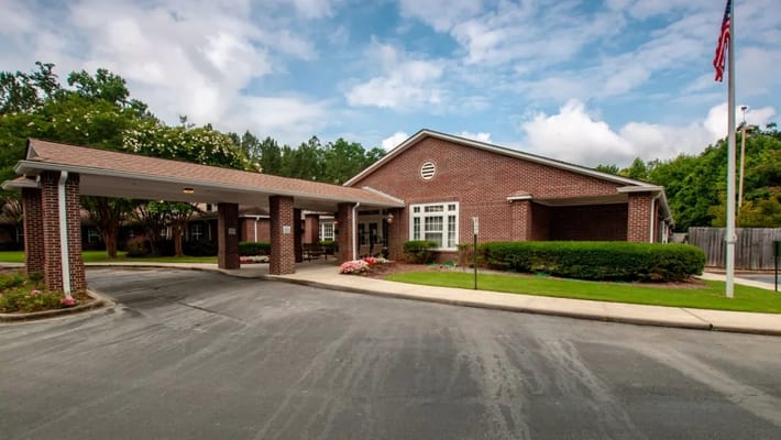 Exterior view of Briar Glen Alzheimer’s Special Care Center with a canopy entrance