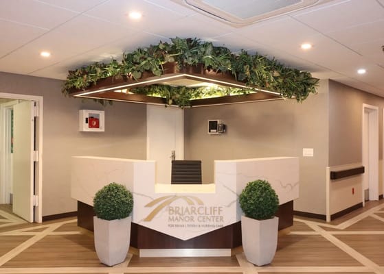 Reception area of Briarcliff Manor Center with greenery decorations