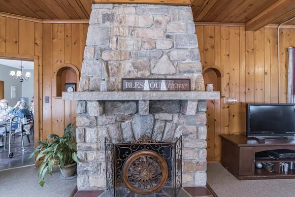 Cozy common area with a stone fireplace