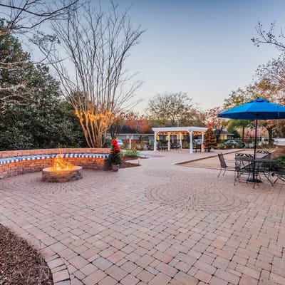 Outdoor courtyard with seating and a fire pit