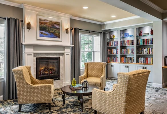 Comfortable common area with seating and bookshelves