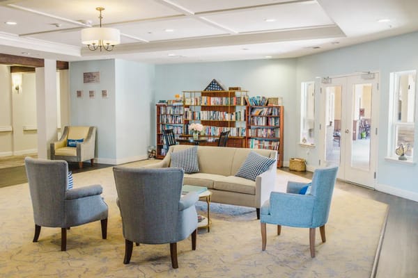 Cozy common area with seating and bookshelves