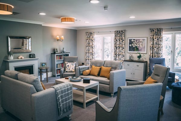 A cozy common area with comfortable seating and natural light