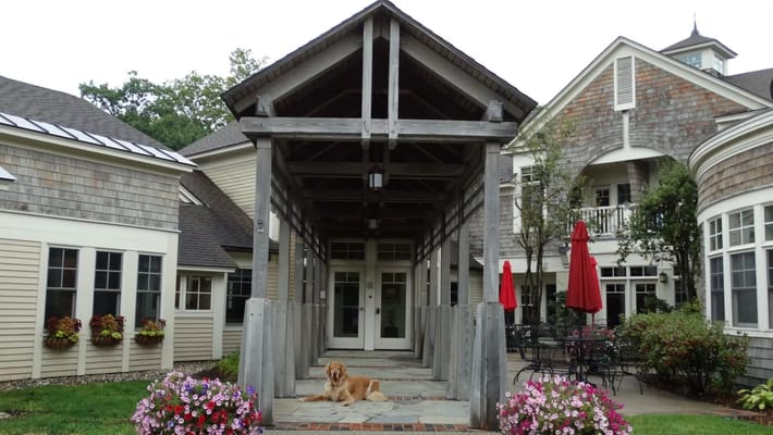 Entrance to a senior living facility with outdoor seating