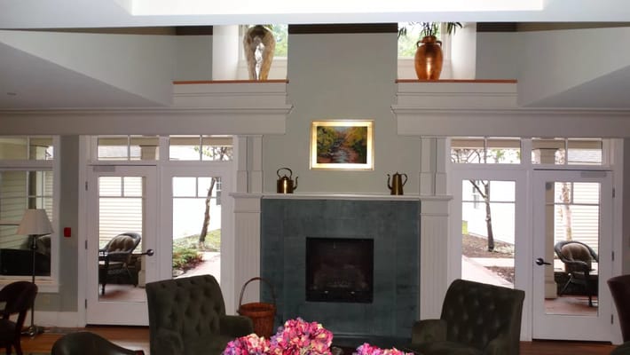 Common area with seating near a fireplace