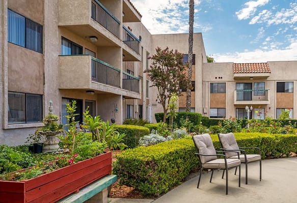Outdoor garden area with seating and building facade