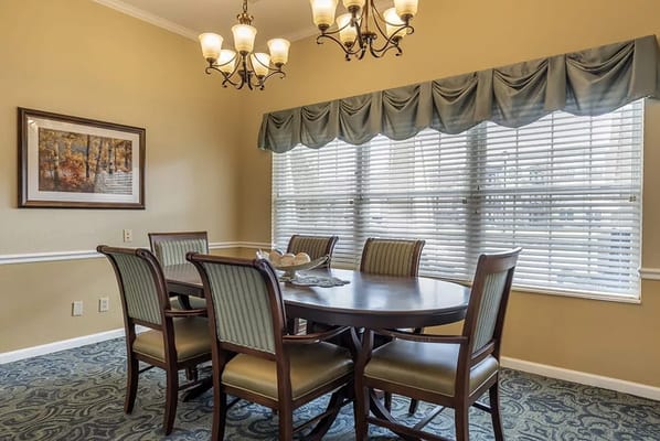 Dining area with a round table and chairs